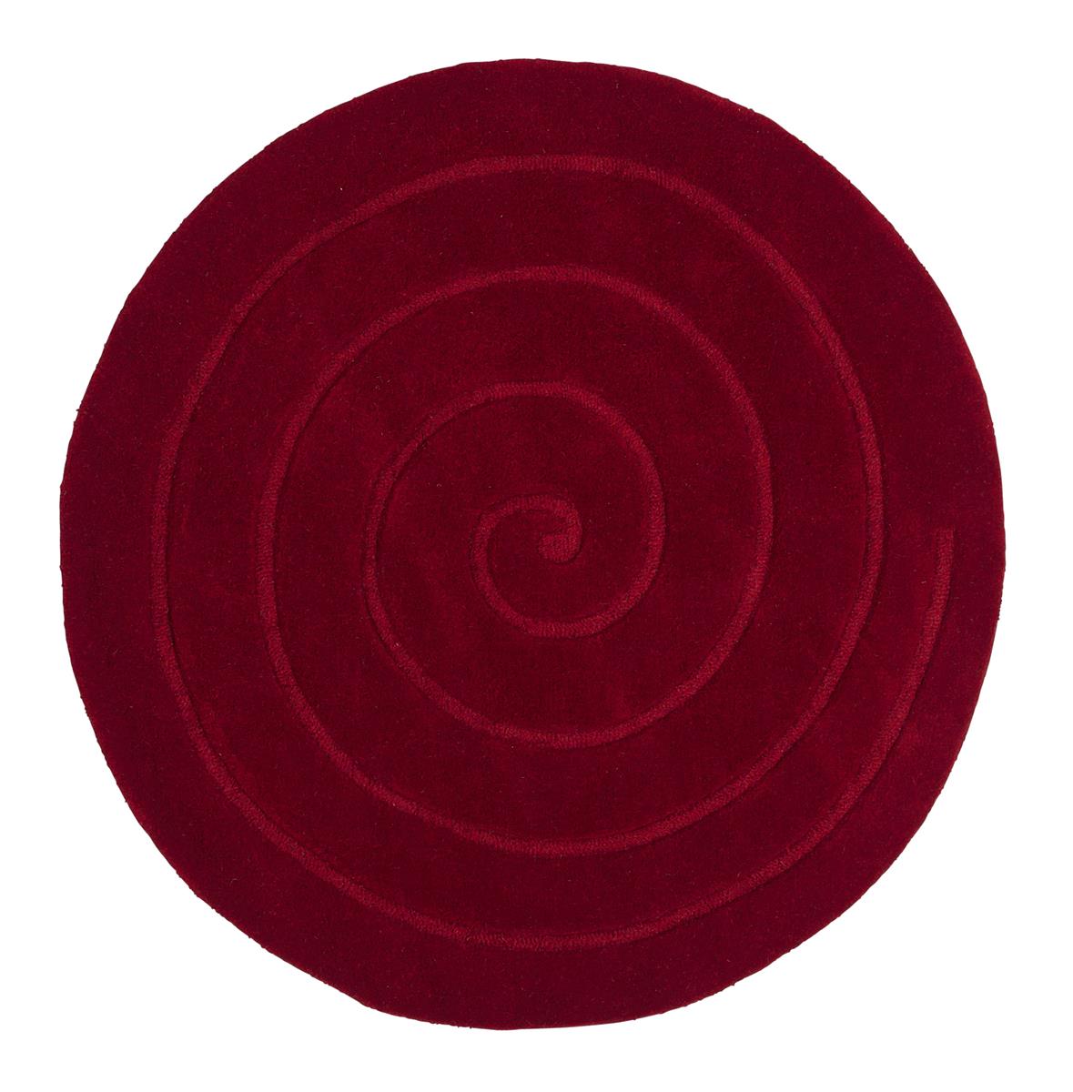 This luxurious red circular rug, features a hand carved line spiralling